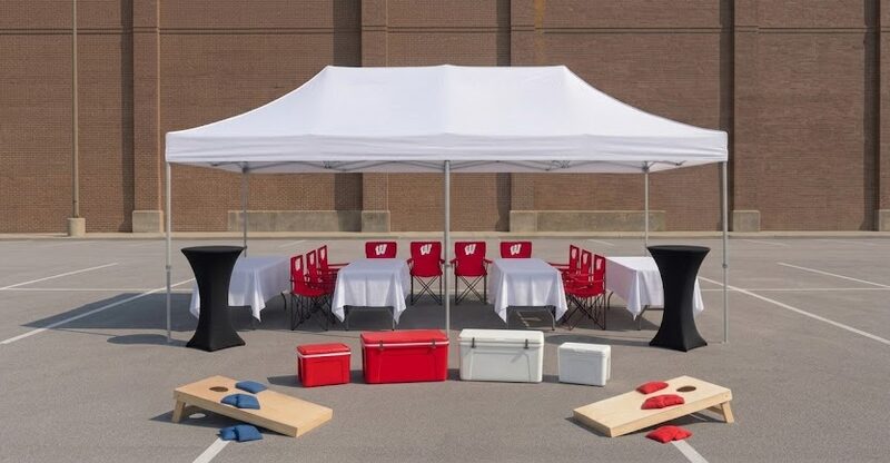 Hall of Fame Cabana package rendering — 10x20 tent, four tables and 10 Wisconsin Badgers chairs with cocktail tables, coolers and cornhole.