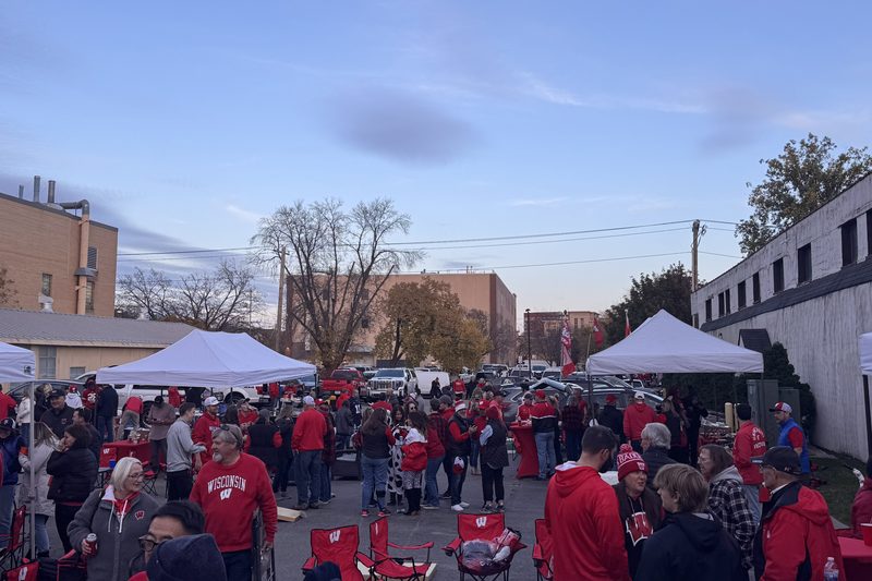 Badgers fans, tents and tailgate seating filling the Regent Street Fan Fest footprint near Camp Randall in Madison.