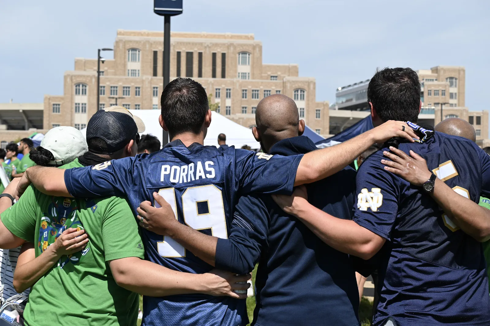 Notre Dame fans tailgating together outside the stadium